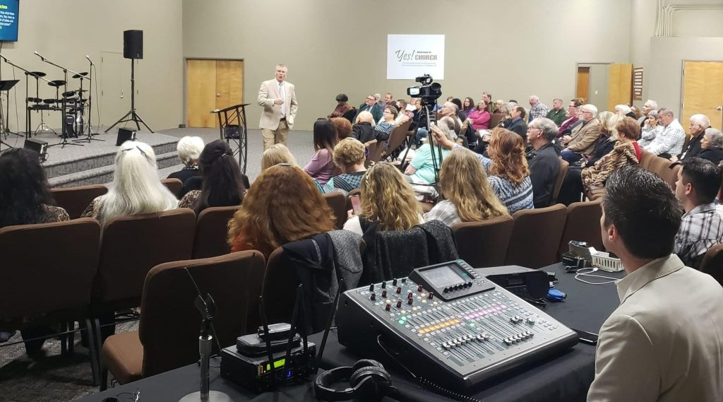 Pastor preaching during church service