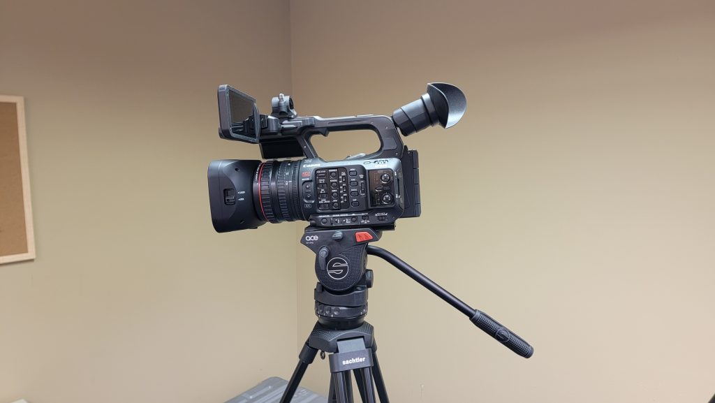 Canon XF605 video camera and tripod